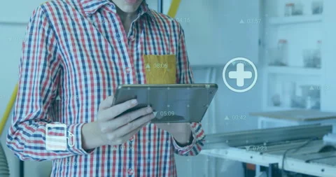 Female technician tapping tablet with stylus in tech workshop browsing service Stock Footage 312017542