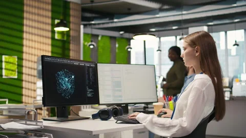 Female technician testing generative AI machine learning algorithms at work Stock Footage 313167661