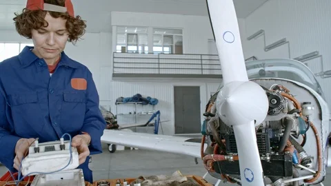 Female Technician Testing Jet Engine Stock Footage 85545394
