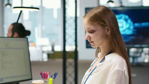 Female technician using AI LLM chatbot to automate tasks in office 스톡 동영상 313015533