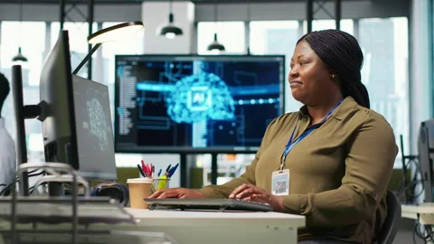 Female technician using computer to write code, developing machine learning API Stock Footage 313017986