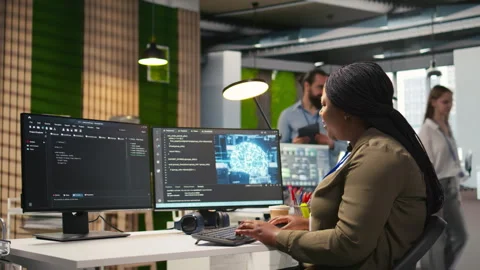 Female technician using computer to write code, developing machine learning API Stock Footage 313166914