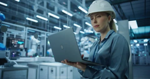 Female Technician Using Laptop in Robotics Factory Stock Footage 319830125