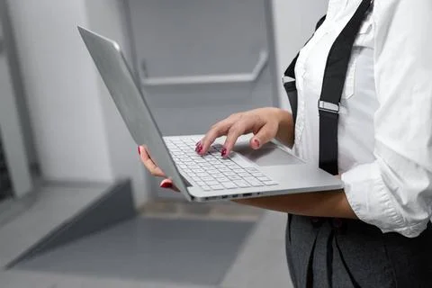  Female technician using laptop in server room Portrait of technician work... Stock-Fotos