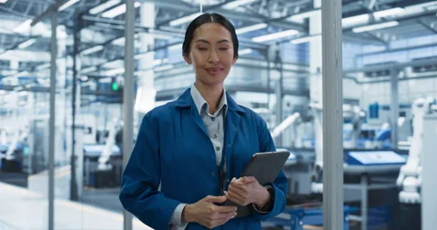 Female Technician Working on Tablet at Electronics Factory Video stock 256044613