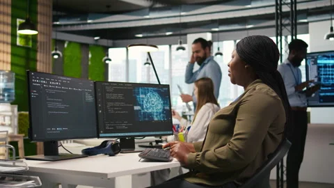 Female technician writing code on PC, developing neural networks APIs Stock Footage 313017103