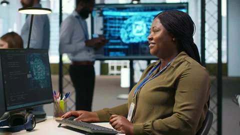 Female technician writing code on PC, developing neural networks APIs Stock Footage 313164804