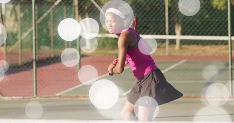 Female tennis player preparing, executing 2-handed backhand to return incoming Video stock 330717897