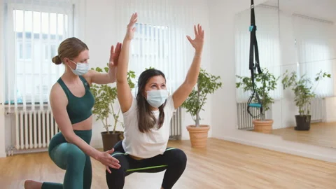 Female therapist helping client exercising in his office Stock Footage 149976853