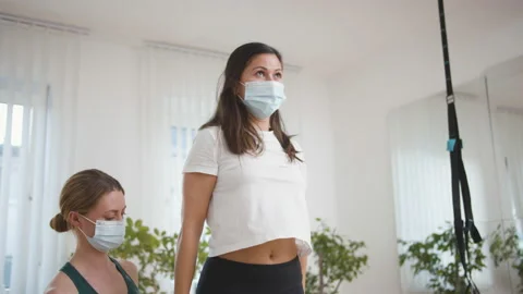 Female therapist helping client exercising in his office Stock Footage 149976993