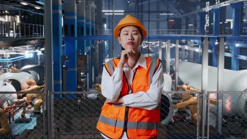 Female Thinking About Something And Looking Around In Factory Of Wind Turbines Stock Footage 270221401