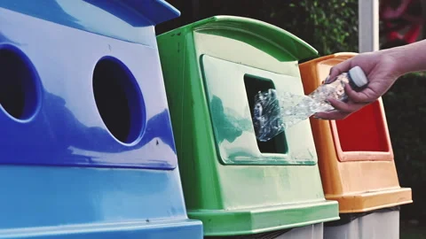 Female throw plastic bottle into recycle bin Video stock 146628877