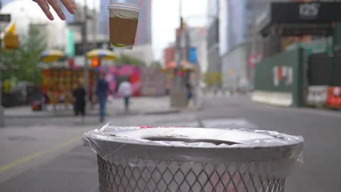 Female Throwing Empty Coffee Cup to The Trash in slow motion 180fps Stock Footage 127754526