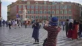 Female tourist photographing friend near Fountain of the Sun, Massena Place HD Footage