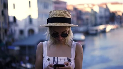 Female tourist using cellular Stock Footage 100201662