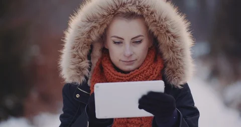 Female Tourist Using Digital Tablet in Forest in Winter Stock Footage 124619627