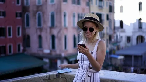 Female tourist using smartphone Stock Footage 100201749