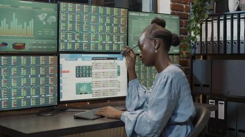 Female trader brainstorming ideas to develop forex stock market Stock Photos