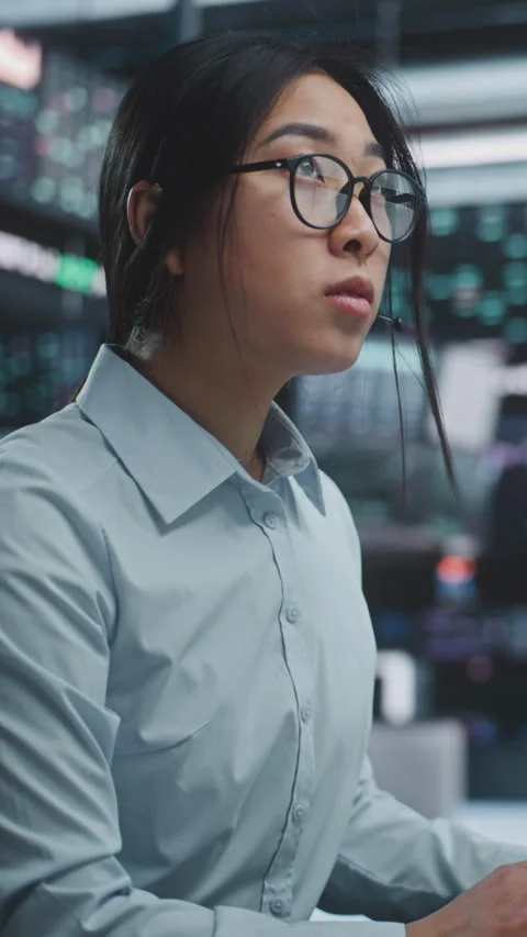 Female Trader Executing Stock and Cryptocurrency Deals in Innovative Digital Stock Footage 329886313