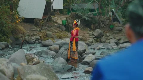 Female Traditional Dancer Posing on River Stones in Nature Stock Footage 278572910