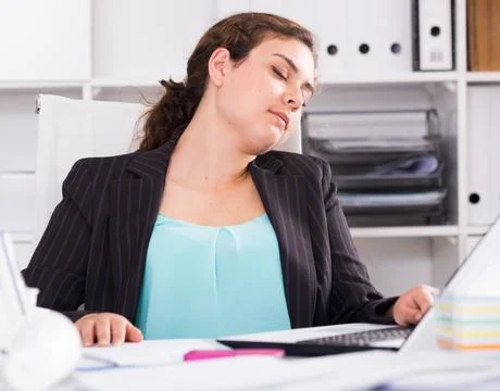 Female trainee is sleeping at work after putting the reports Stock Photos