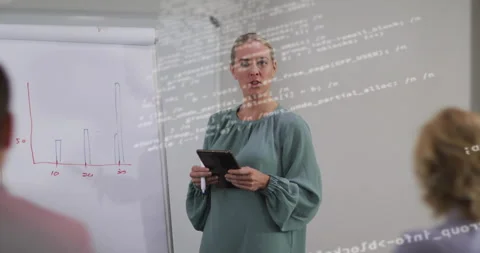 Female trainer drawing red bar chart glancing tablet explaining business growth Stock Footage 314662494