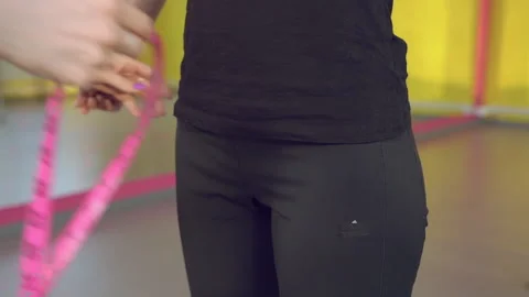 Female trainer hands measuring hips of her client woman with centimeter tape Stock Footage 130892489