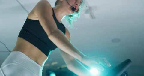 Female trainer leading a spin class Stock Footage 97471433