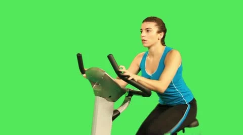 Female training on exercise bicycle Stock Footage 12159248