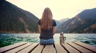 Female Traveler Feel Calm And Do Mindful Meditation Sitting On Bridge In Nature Stock Footage