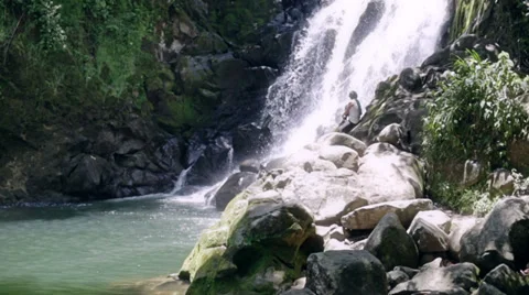 Female trekker on cascade Stock Footage 38646334