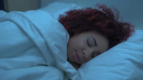 Female trying to fall asleep in bed, sleeping disorder, health care, anxiety Stock Footage 123298575
