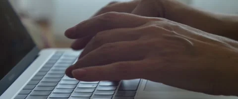 Female types on modern computer keys anamorphic 5.7K footage Stock Footage 303638406