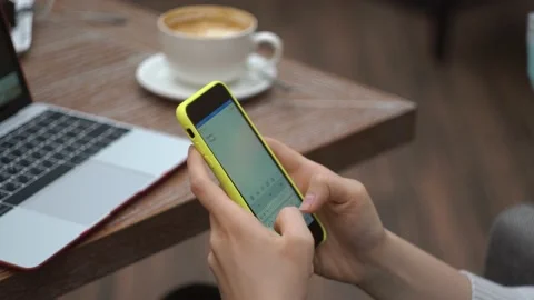 Female types text on phone close-up, sends a message, makes a plan for the day Stock Footage 147444182