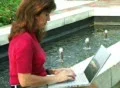 Female Typing by Fountain Footage
