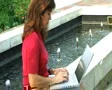 Female Typing by Fountain SD Footage