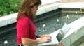 Female Typing by Fountain HD Footage