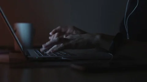 Female typing on laptop in evening 動画素材 70788932