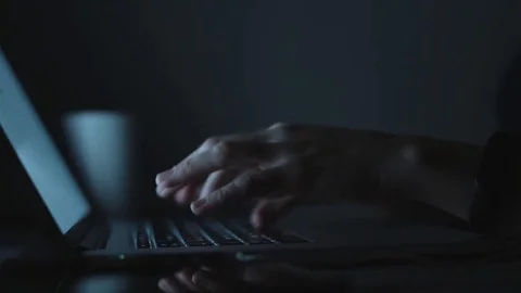 Female typing on laptop in evening Stock Footage 70790680
