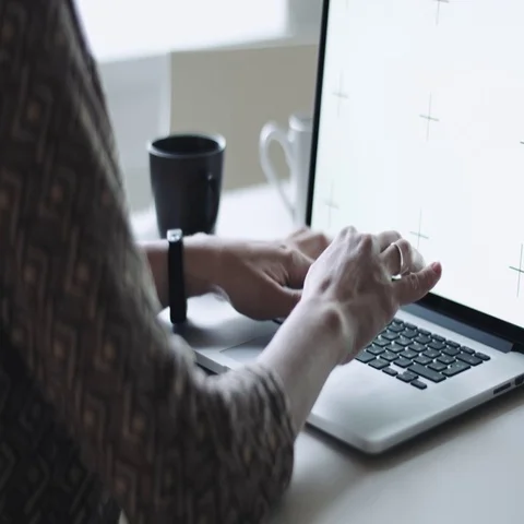 Female typing on laptop at workplace Stock Footage 69286563