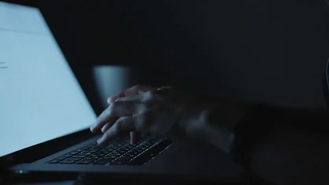 Female typing sitting by table in evening Stock Footage 70790738