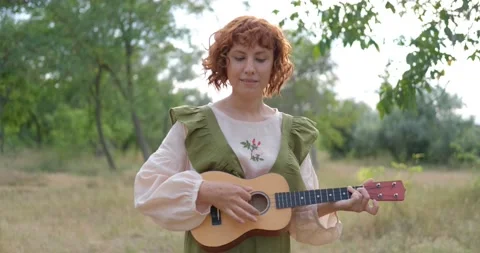Female with ukulele Stock Footage 139355649