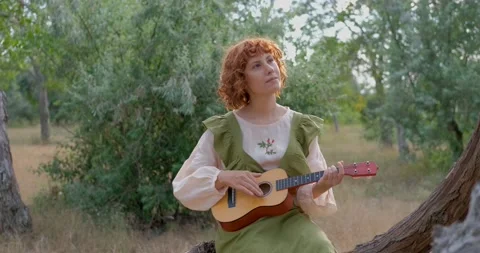 Female with ukulele Stock Footage 139355650