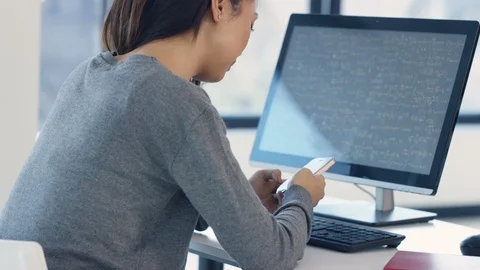 Female university students using mobile phone during physics lecture Stock Footage 106674531