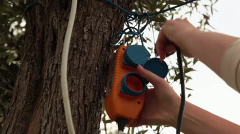 Female Unplugging Power Cable in the Nature Video stock 11154028
