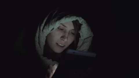 Female use a digital tablet at night Stock Footage 83916242