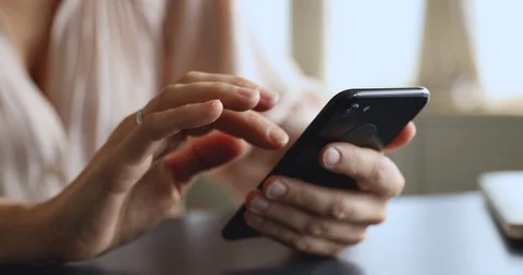 Female user holding using modern cell phone device, closeup Stock Footage 122696285