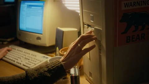 Female User Working on Document on Retro Computer and Saving on Floppy Disk Stock Footage 327238144
