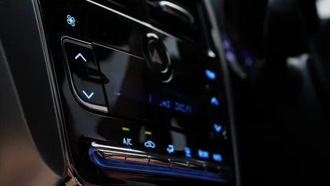 Female using air control panel inside car Stock Footage 89231448