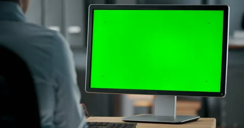 Female using computer with green screen for work at office Stock Footage 139406409